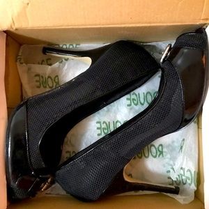 Black buckle pumps